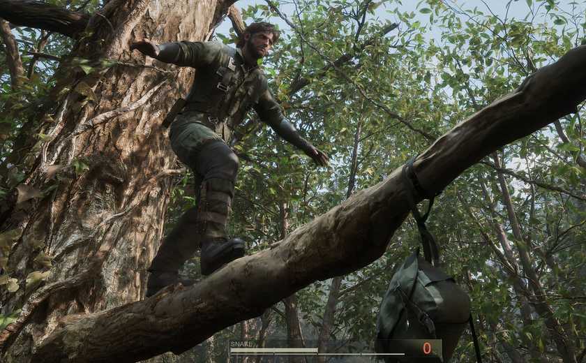 Snake climbing across a branch in Metal Gear Solid 3 Delta Snake Eater.